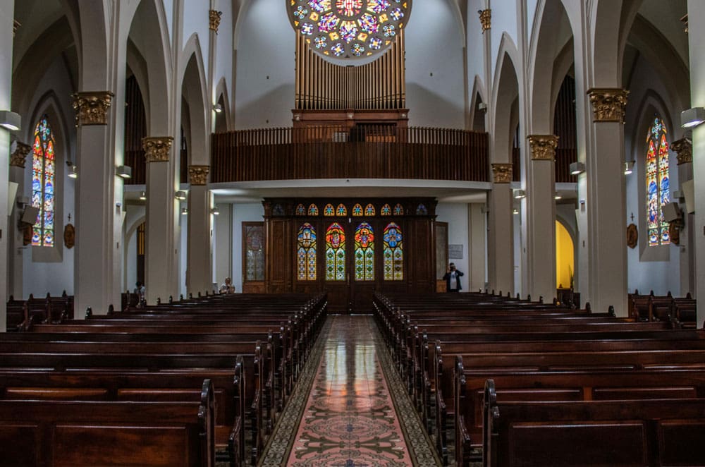 beautiful church with wooden pews and stained glass windows